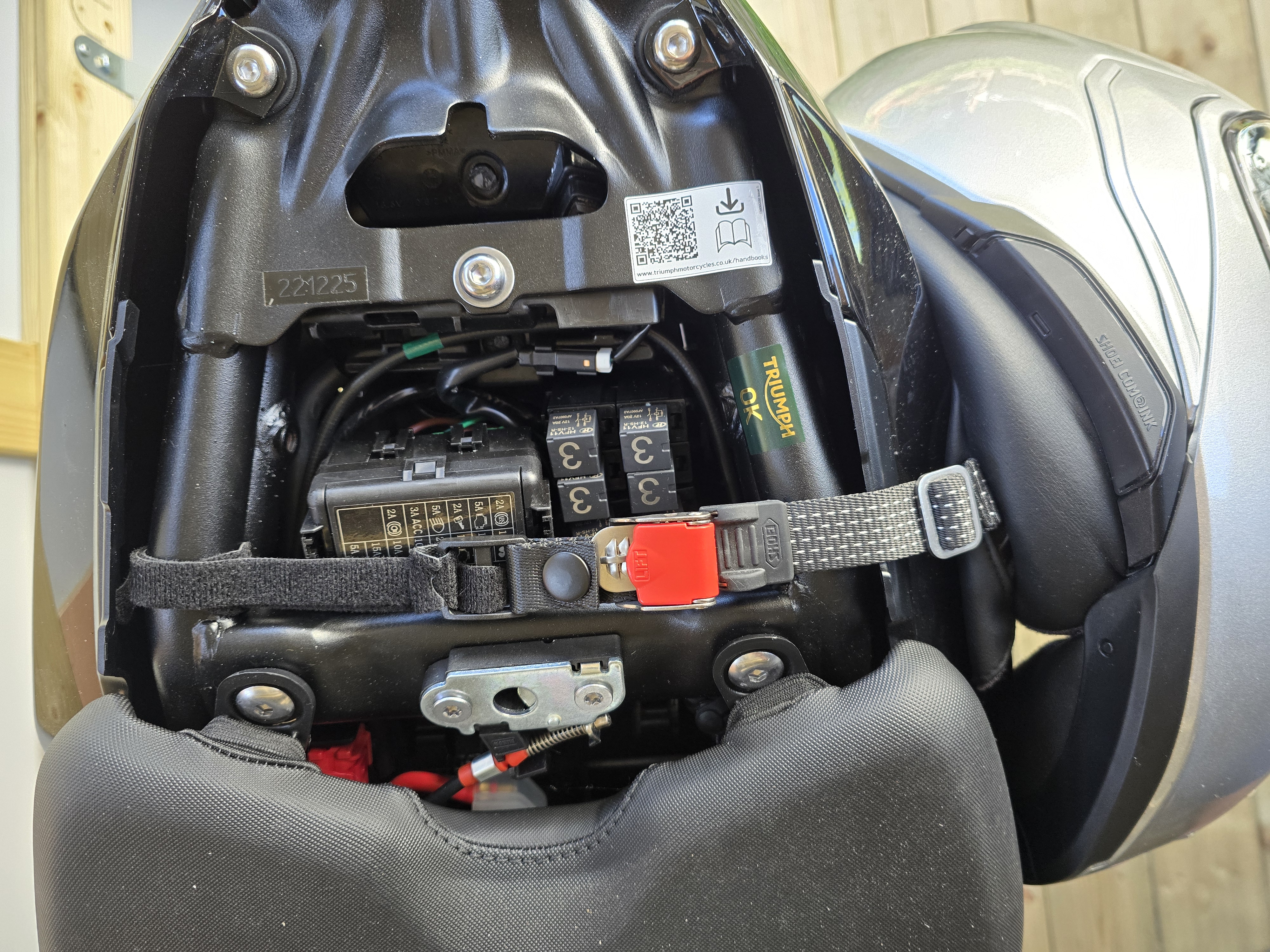 Triumph Trident 660 helmet buckle under rear seat